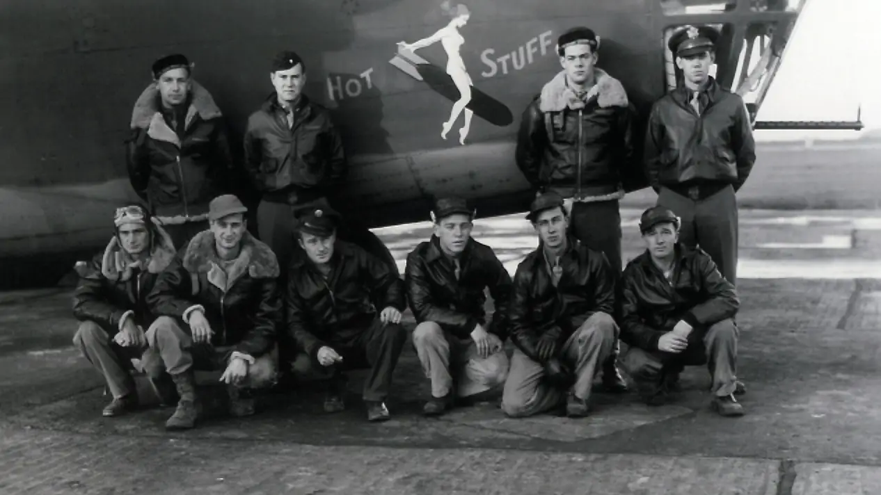 The crew of B-24D Hot Stuff pose in front of their Liberator