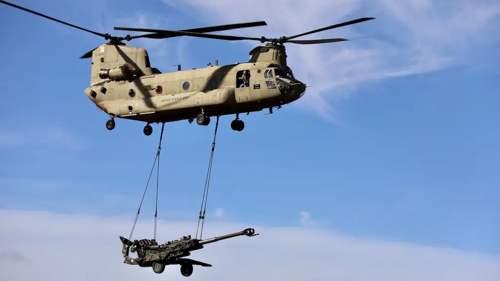 CH-47 Chinook from the 25th Combat Aviation Brigade carries a M777 Howitzer