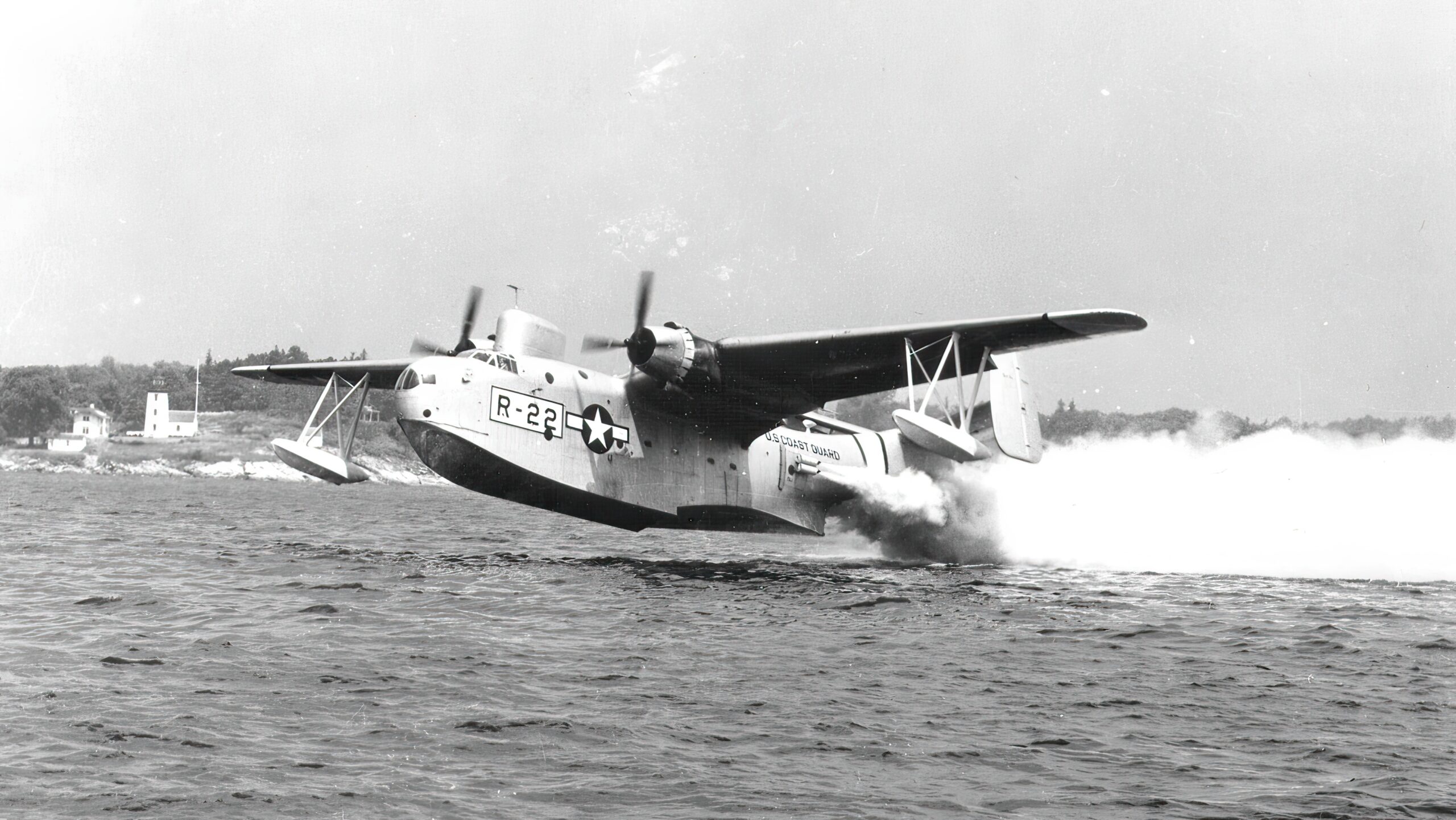 U.S. Coast Guard PBM takes off from the water assisted by RATO