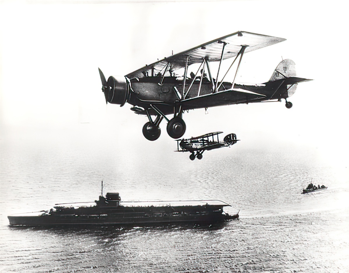 Fleet Air Arm Blackburn Shark in company with a Westland Wapiti, seen flying over HMS Courageous