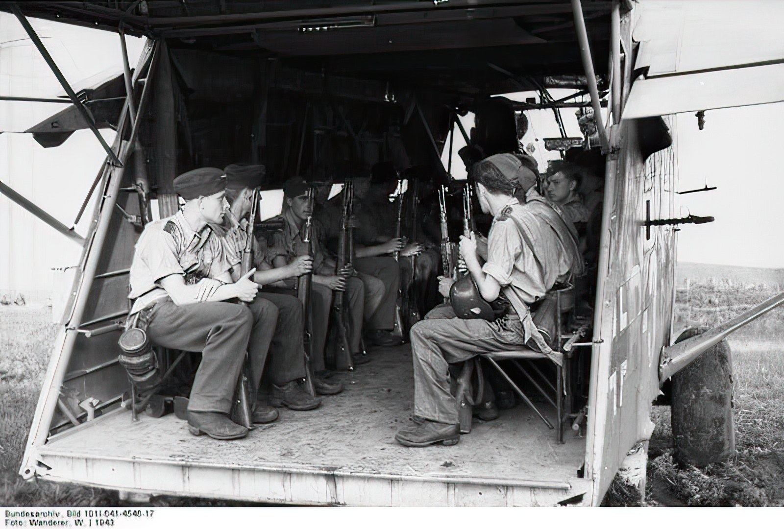 German troops seated in a Go 242, Russia, 1943. The glider is fitted with defensive machine guns