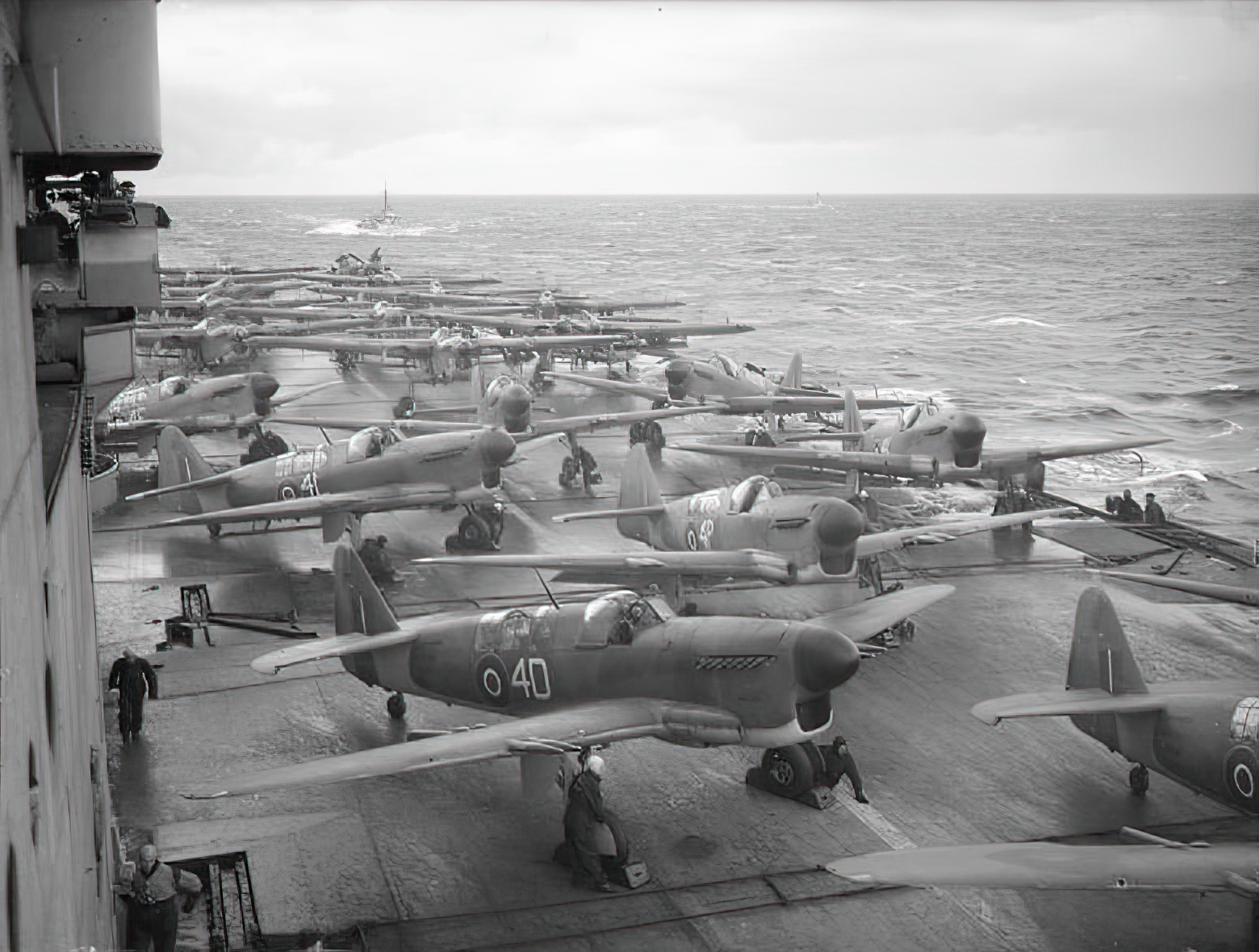  Fairey Fireflies (1771 Squadron), Fairey Barracudas (828 Squadron), and Supermarine Seafires (880 Squadron) of the Fleet Air Arm on the flight deck of HMS Implacable (R86) warming up ready to make strike on enemy shipping at the entrance to Alten Fjord, Norway 1944