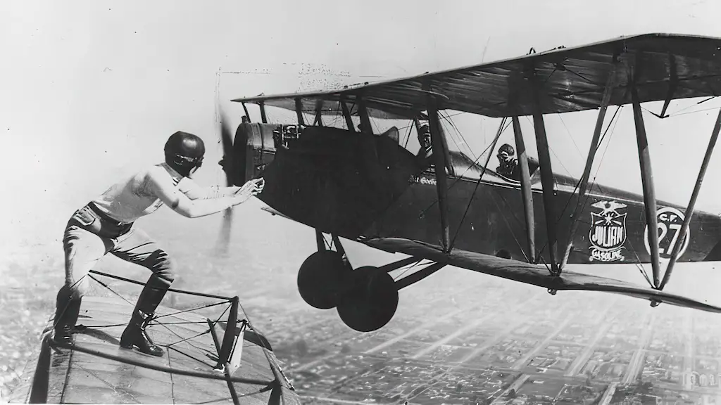 Gladys Ingle is preparing to move from Bon MacDougall's Jenny to Art Goebel's aircraft mid-air 1926