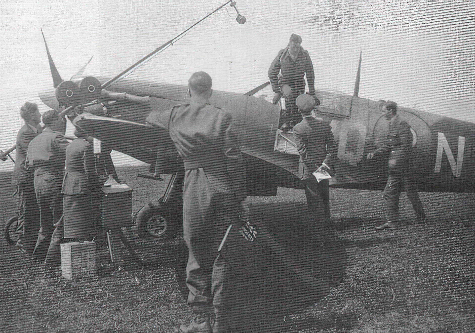 RAF ace Johnnie Johnson climbing out of the cockpit of his Spitfire. Kings Cliffe 1941