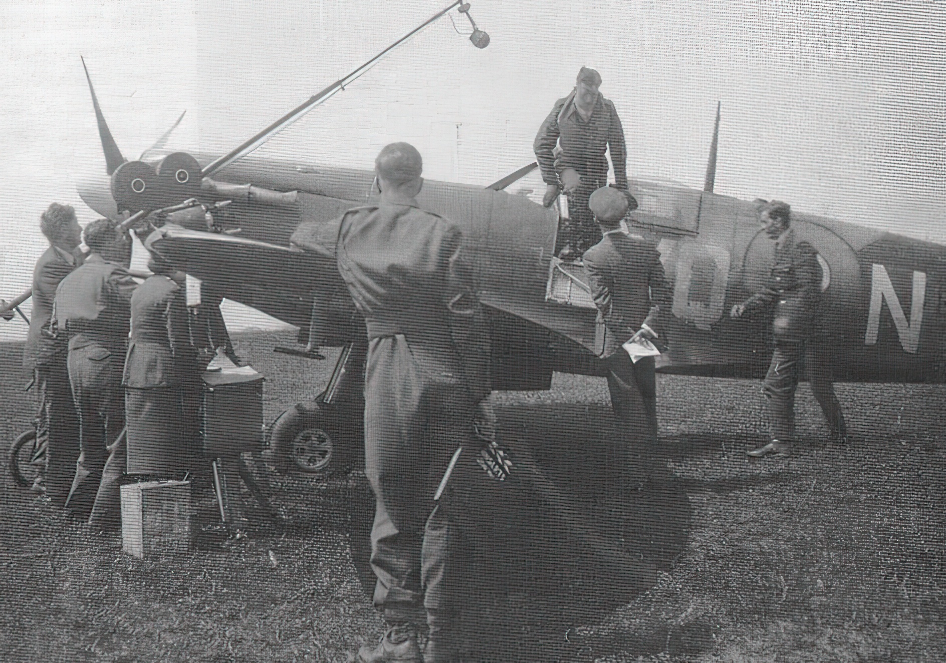  RAF ace Johnnie Johnson climbing out of the cockpit of his Spitfire. Kings Cliffe 1941