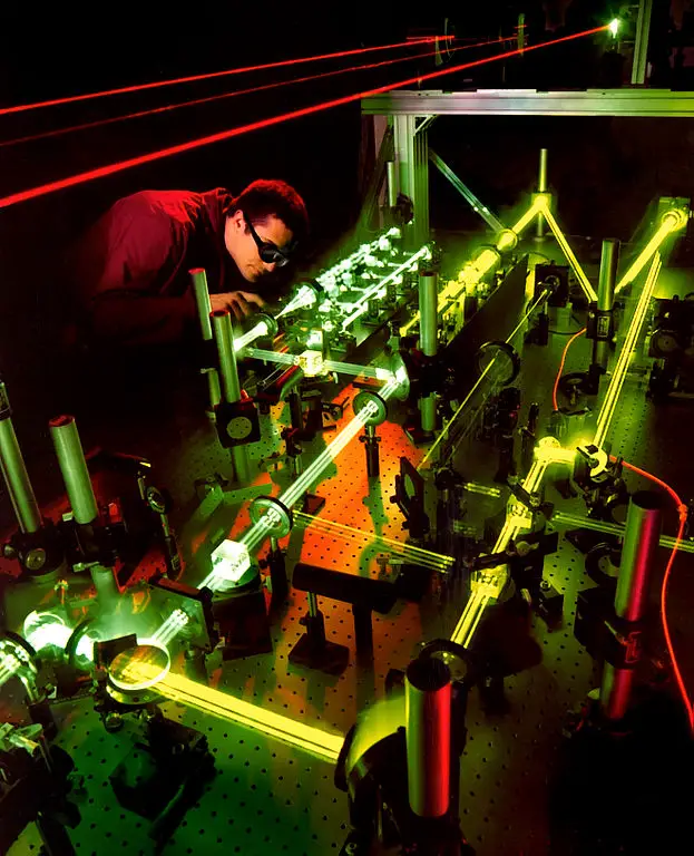 An optical engineer evaluates the interaction of multiple lasers that will be used aboard the Airborne Laser, a megawatt-class laser weapons system being developed to defend against ballistic missile attacks