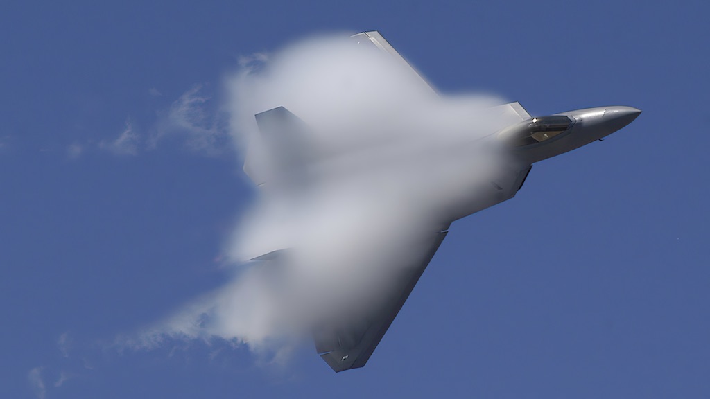 Vapor trails disperse in the wake of a U.S. Air Force F-22A Raptor aircraft at the 42nd Naval Base Ventura County (NBVC) Air Show at Point Mugu, Calif.