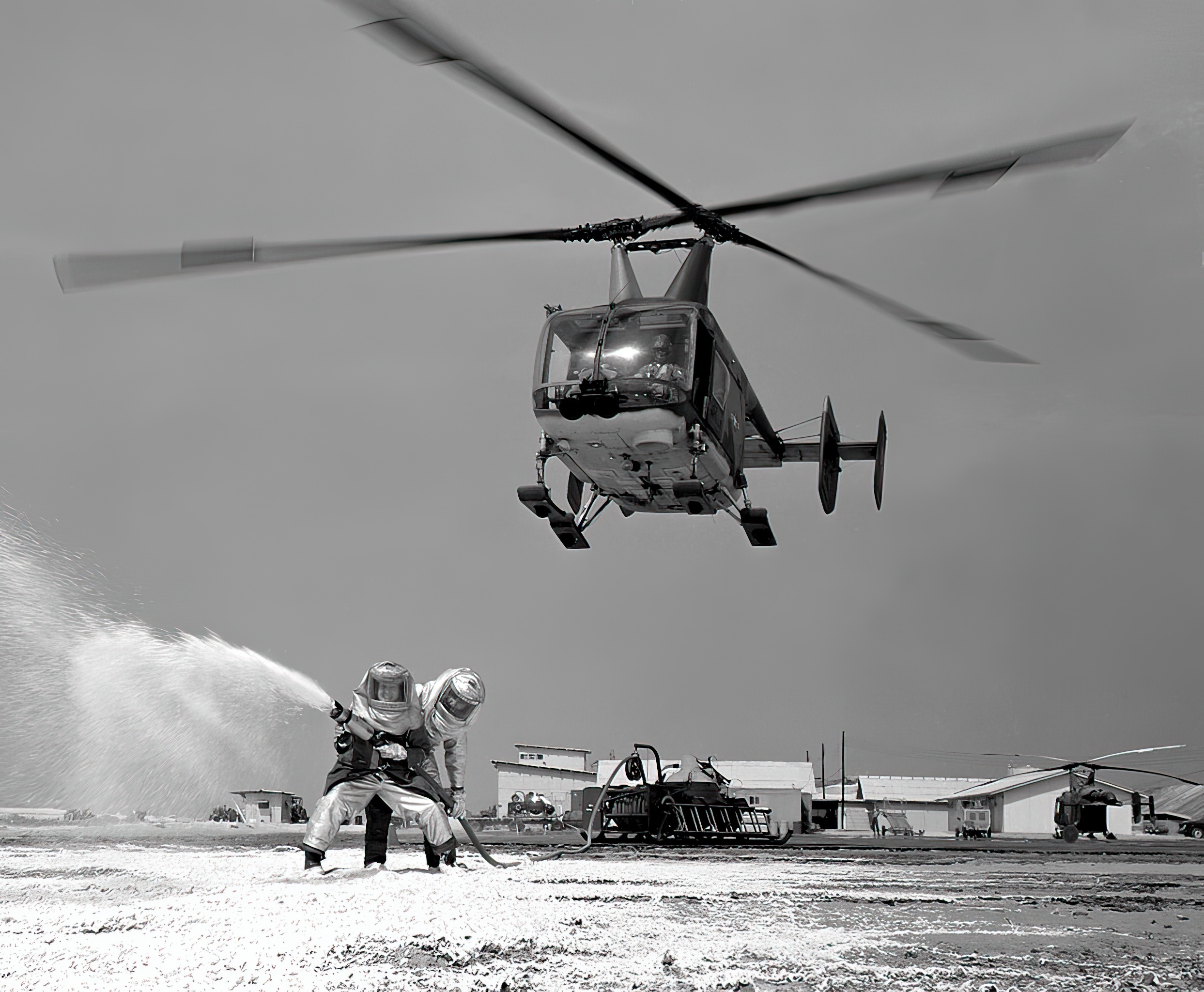 A USAF Huskie aids a practice firefighting operation at Cam Ranh Bay Air Base, Vietnam in 1968