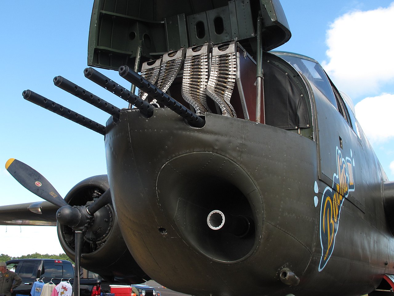 B-25"Barbie III" with nose canopy open, showing the 4 - .50 cal Browning feeds, and 75mm M5 gun