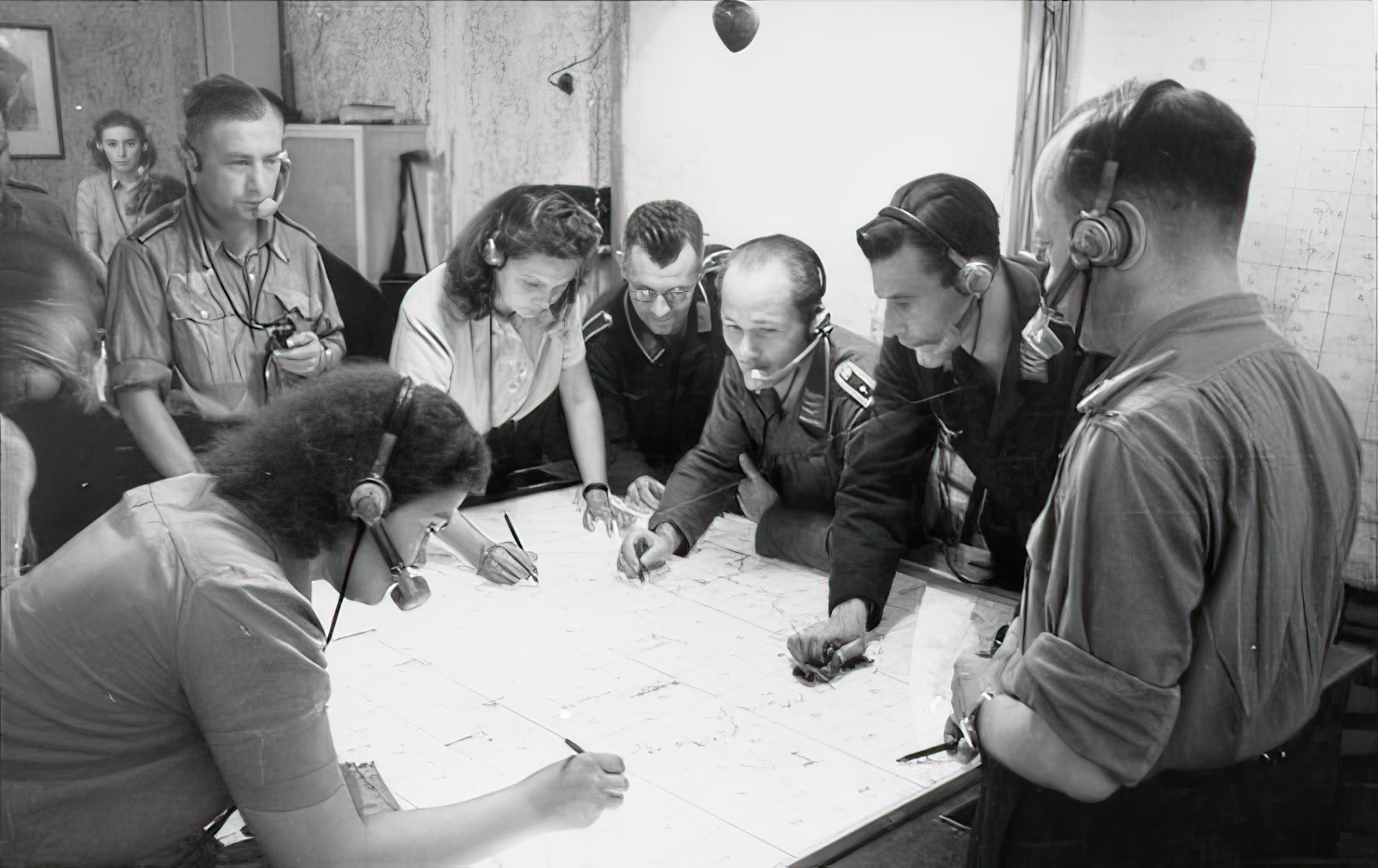 Radio control center for night fighters, Jägerleitoffiziere and assistants plotting courses and directing the airborne fighters