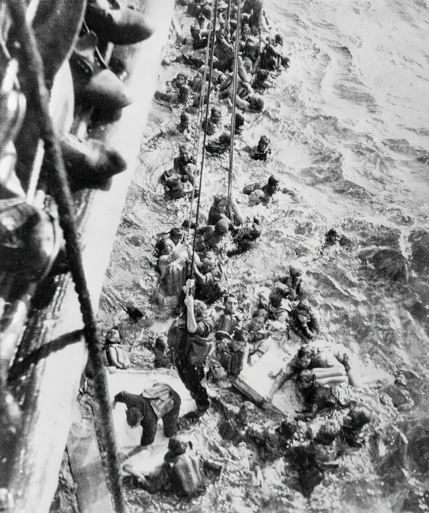 Survivors from the Bismarck are pulled aboard HMS Dorsetshire (40) May 27 1941