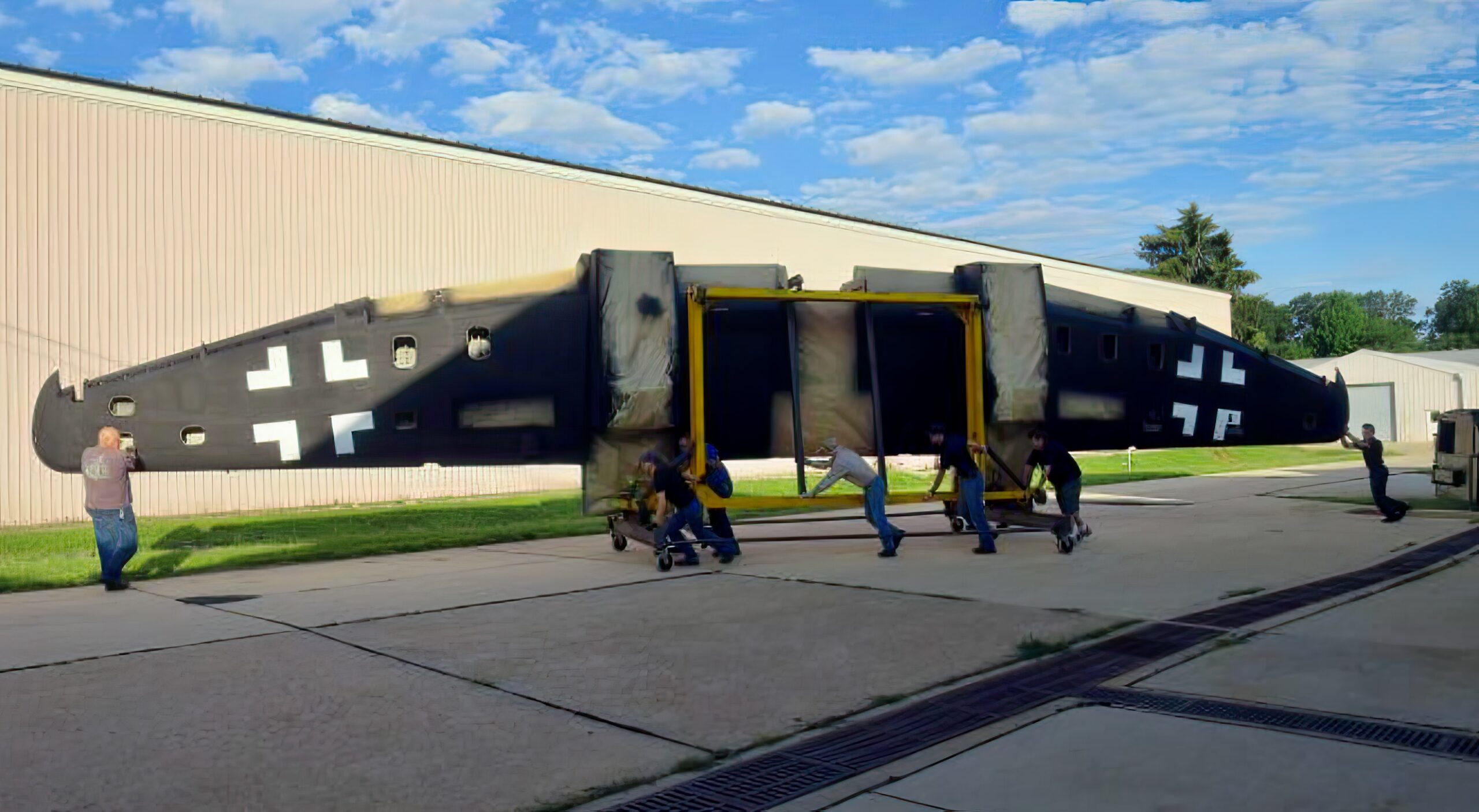 he He 219 wing is rolled out of the paint booth, standing 4 m (13 feet) high and about 19 m (63 feet) long. (photo via NASM)
