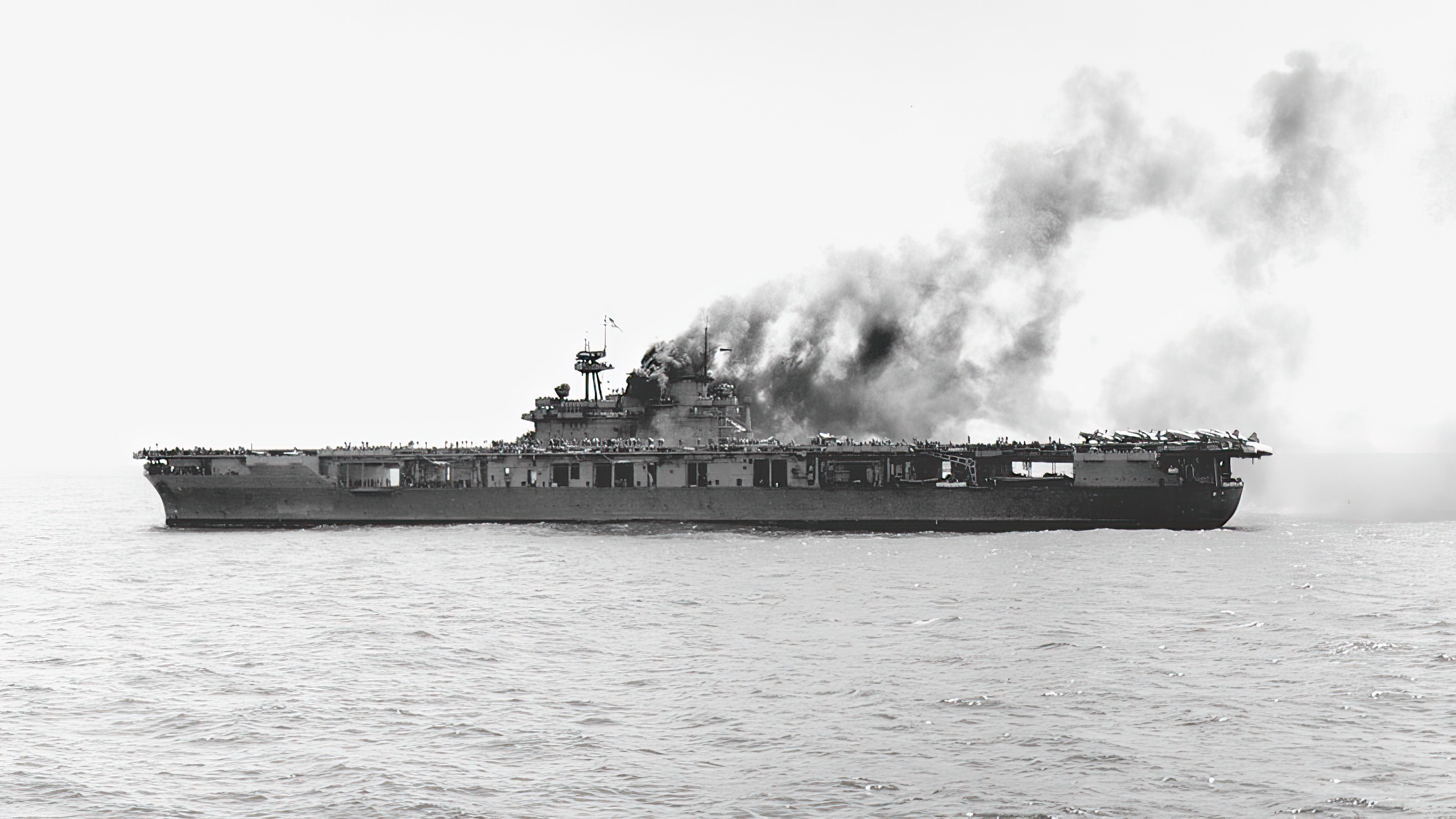 U.S. Navy aircraft carrier USS Yorktown (CV-5) burning after the first attack by Japanese dive bombers during the Battle of Midway