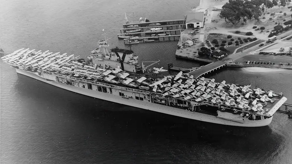 USS Yorktown (CV-5) at Naval Air Station, North Island, San Diego, California, in June 1940, embarking aircraft and vehicles prior to sailing for Hawaii. Aircraft types on her flight deck include TBD-1, BT-1, SBC-3, F3F-2, F3F-3, SB2U, JRF, J2F and JRS-1. Some of these planes were on board for transportation, while others were members of the ship's air group. Three Torpedo Squadron Five (VT-5) TBDs at the after end of the flight deck are painted in experimental camouflage schemes tested during Fleet Problem XXI. Official U.S. Navy Photograph, now in the collections of the U.S. National Archives