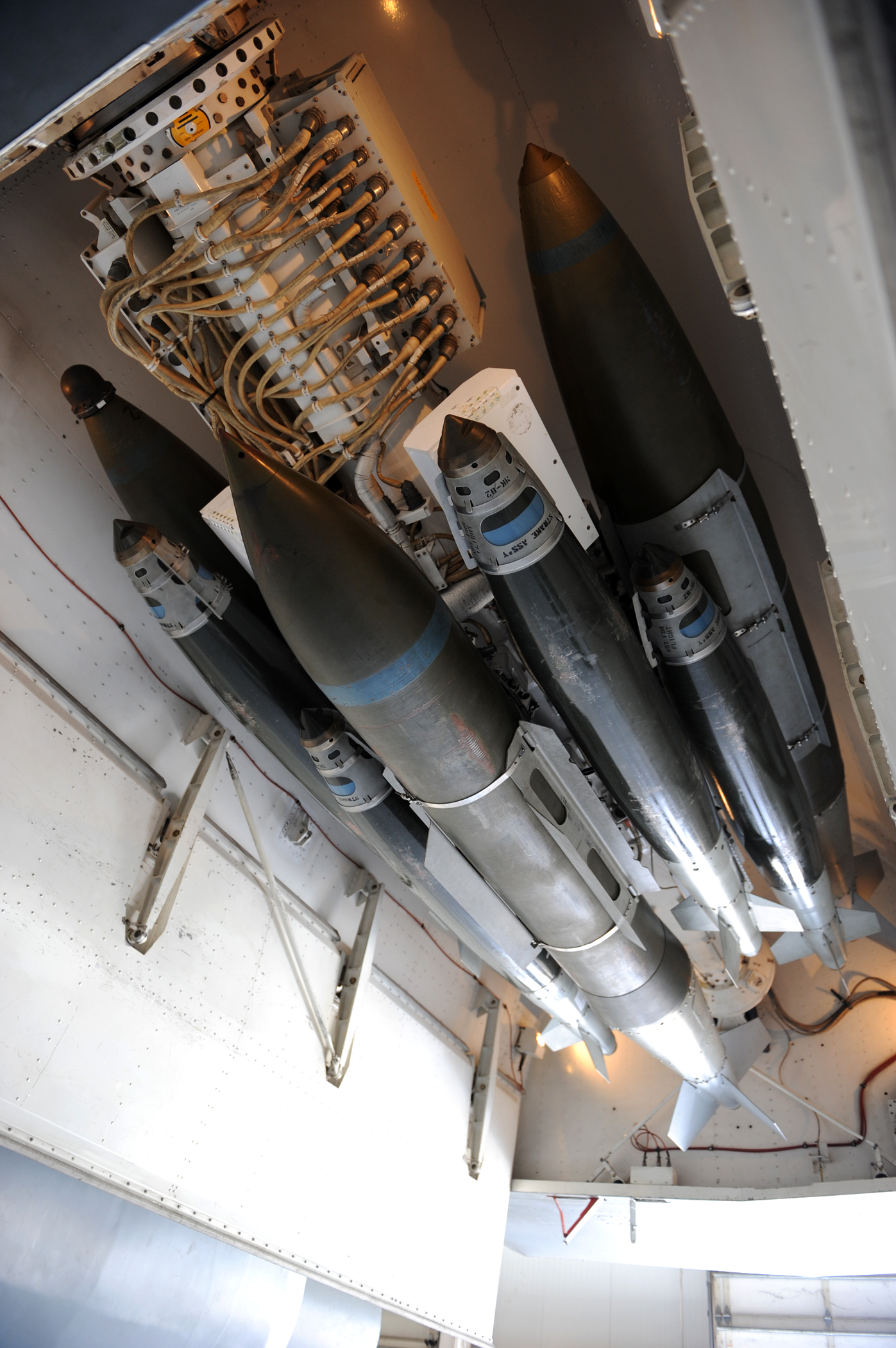 An assortment of 500-pound and 2,000-pound joint direct attack munitions are connected to a multiple ejector rack on a B-1B Lancer March 31, 2011, at a weapons load barn at Dyess Air Force Base, Texas. If fielded, a 16-carry modified rotary launcher will increase the number of 500-pound JDAMs and laser-guided JDAMs carried by a B-1B from 15 to 48, a 320 percent increase in capability. (U.S. Air Force photo/Airman 1st Class Shannon Hall)