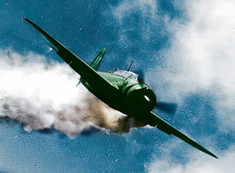 Lt. Yoshinori Yamaguchi's Yokosuka D4Y3 (Type 33 Suisei) "Judy" in a suicide dive against USS Essex on 25 November 1944. The attack left 15 killed and 44 wounded. The dive brakes are extended and the non-self-sealing port wing tank trails fuel vapor and/or smoke