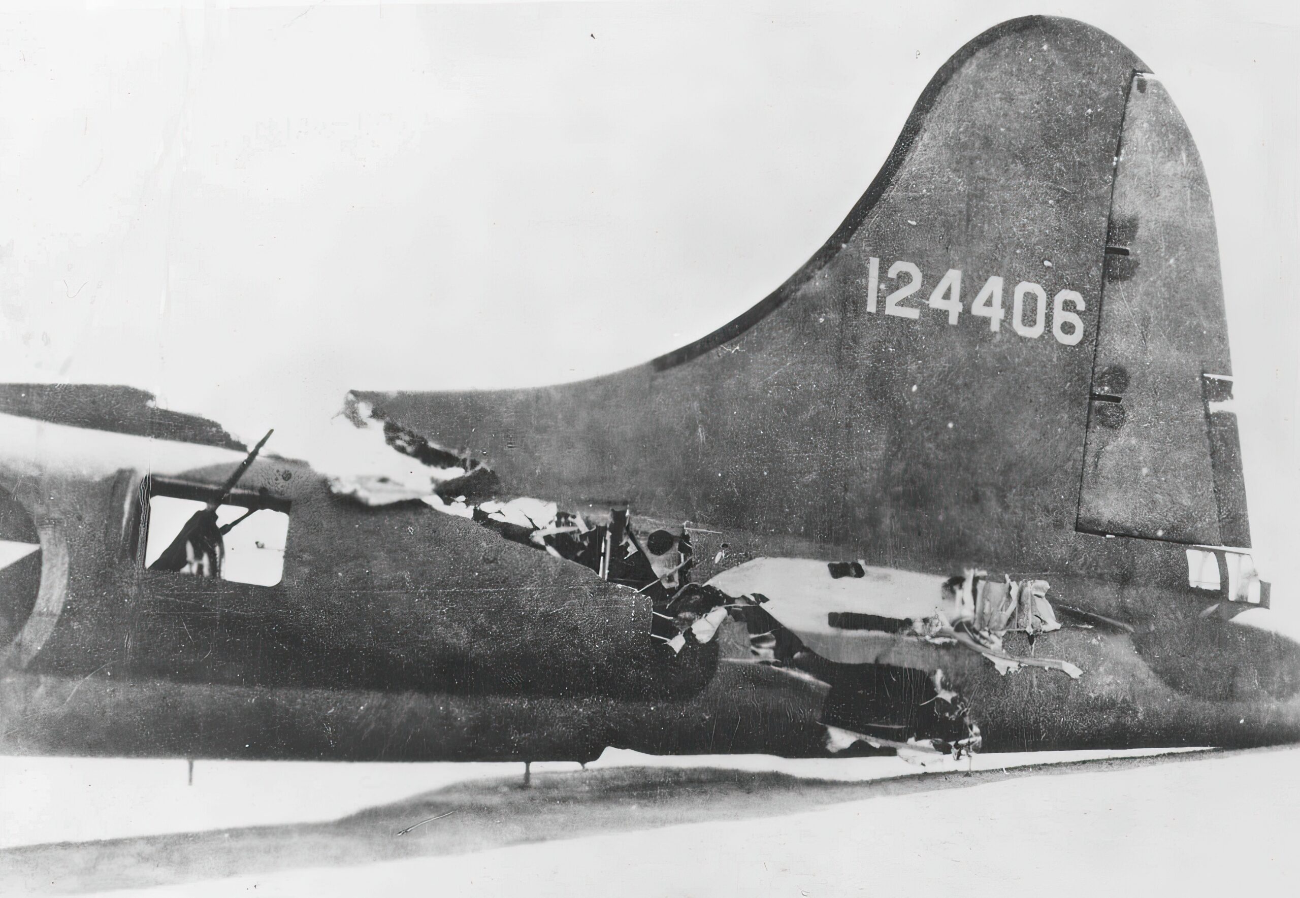 Close-up of the damaged tail of the Boeing B-17F-5-BO (S/N 41-24406) "All American III." The left horizontal stabilizer was torn completely off, and the aircraft was nearly cut in half by the collision