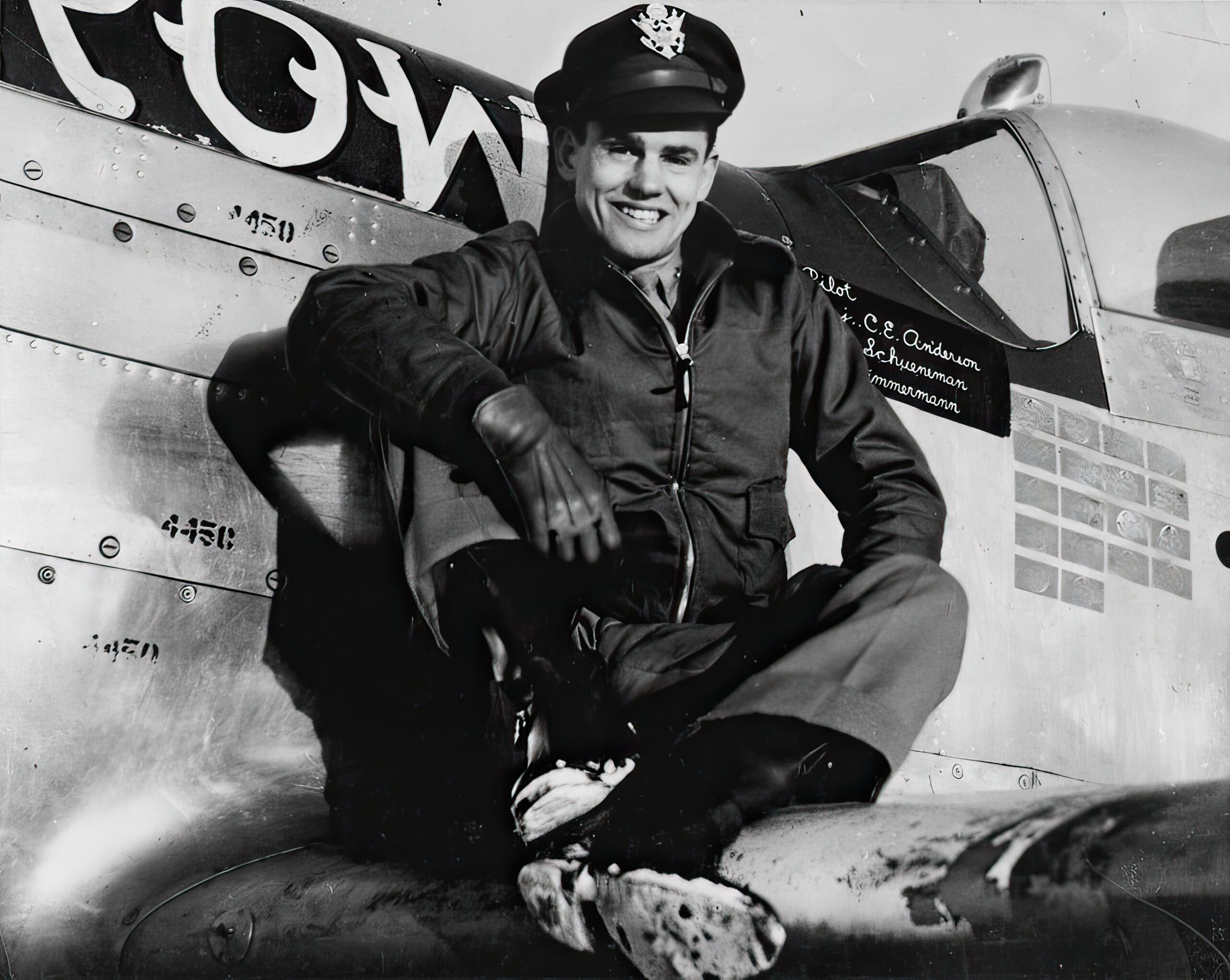 Captain Clarence E. Jr. "Bud" Anderson, ace of the 357th Fighter Group, sits on the wing of his P-51 Mustang (B6-S, serial number 44-14450) nicknamed "Old Crow"