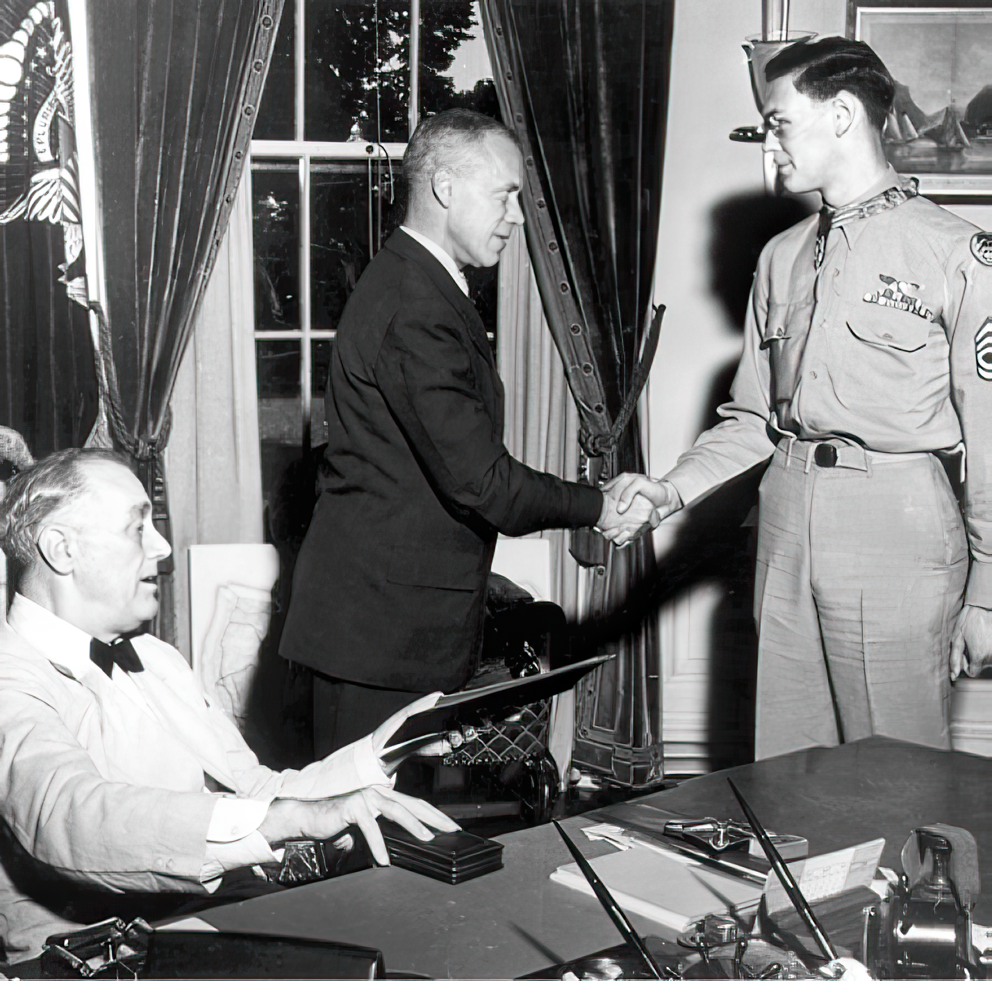 Technical Sergeant Forrest L. Vosler, a B-17 Flying Fortress radio operator, was the second enlisted airman to earn the Medal of Honor. He is seen here receiving the award from Franklin Delano Roosevelt