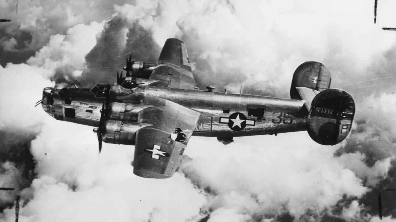B-24 Liberator (serial number 42-95379) nicknamed "Extra Joker" of the 451st Bomb Group, 15th Air Force in flight. Image taken by Leo S Stoutsenberger, Photographic Officer, 451st Bomb Group