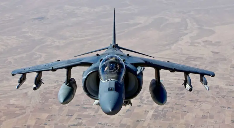 A AV-8B Harrier jet with Marine Attack Squadron 311, flies over Helmand province, Afghanistan June 10, 2013. The jet had just received aerial refueling support from a KC-130J Hercules aircraft with Marine Aerial Refueler Transport Squadron 252, before continuing their air operations. (U.S. Marine Corps photo by Sgt. Gabriela Garcia/Released)