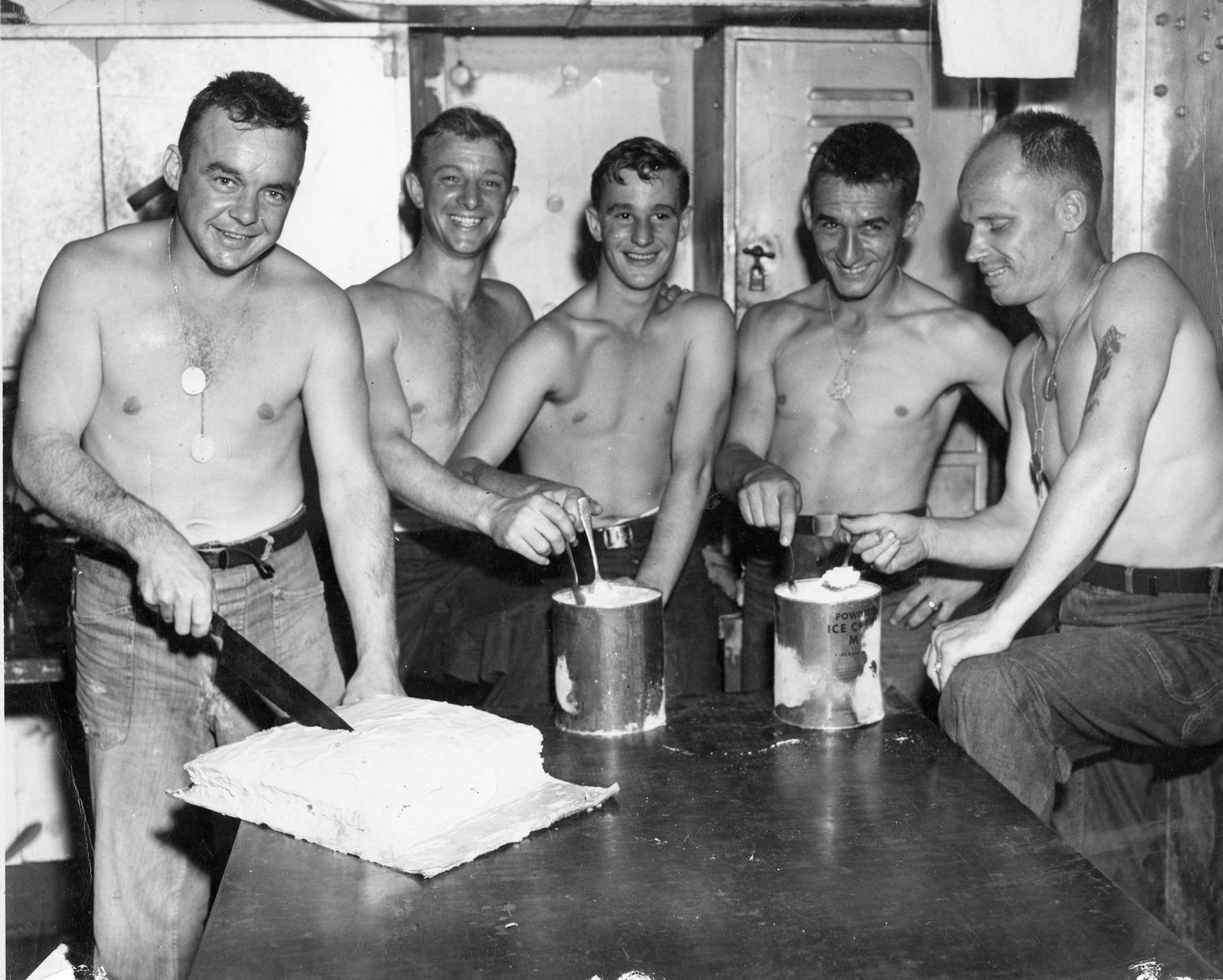 Sailors get ready to enjoy some ice cream and cake