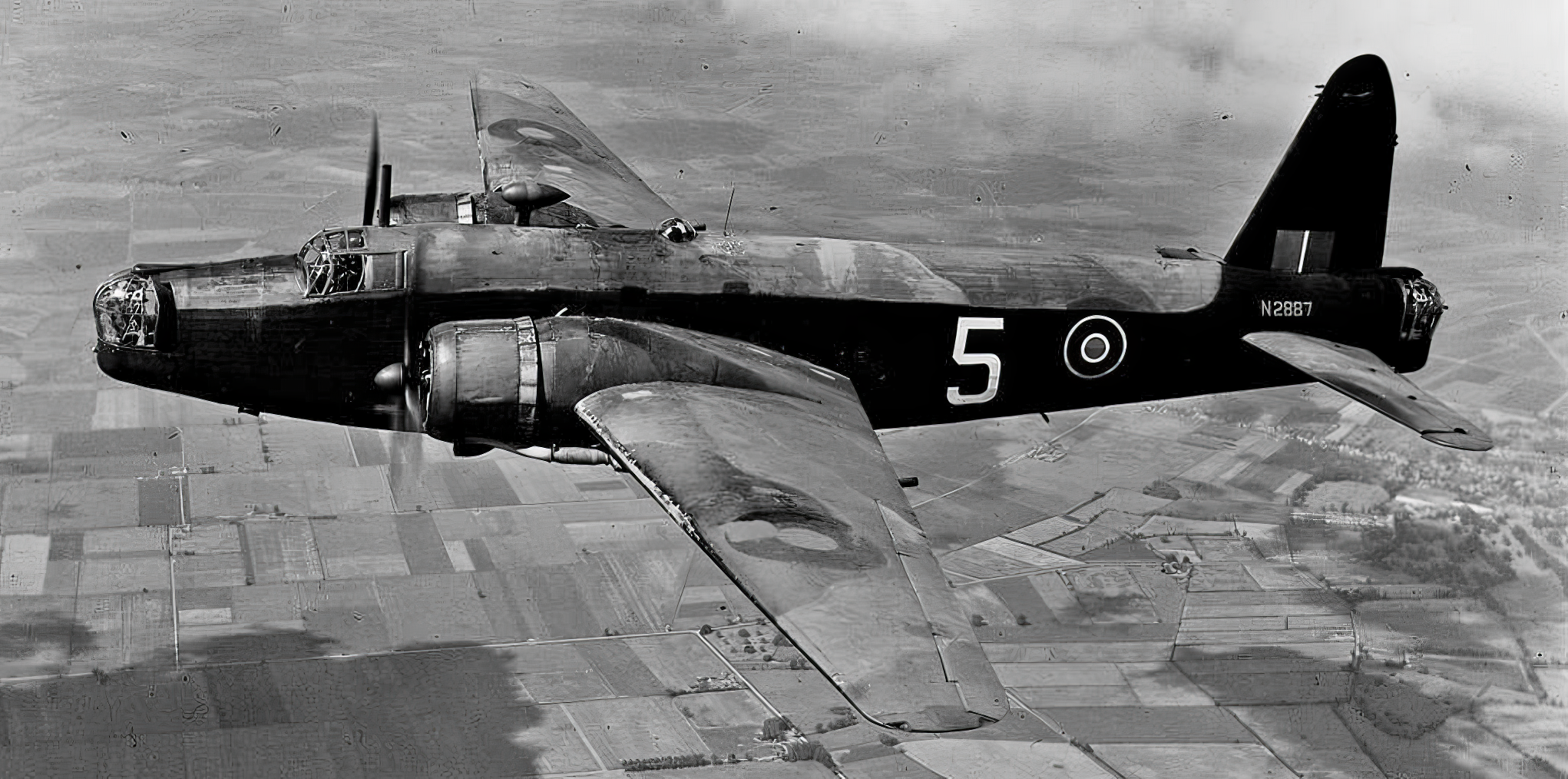  "Wellington Mk.IA (N2887) of the CGS (Central Gunnery School) based at Sutton Bridge flying south-east of Chatteris, 24th June, 1943