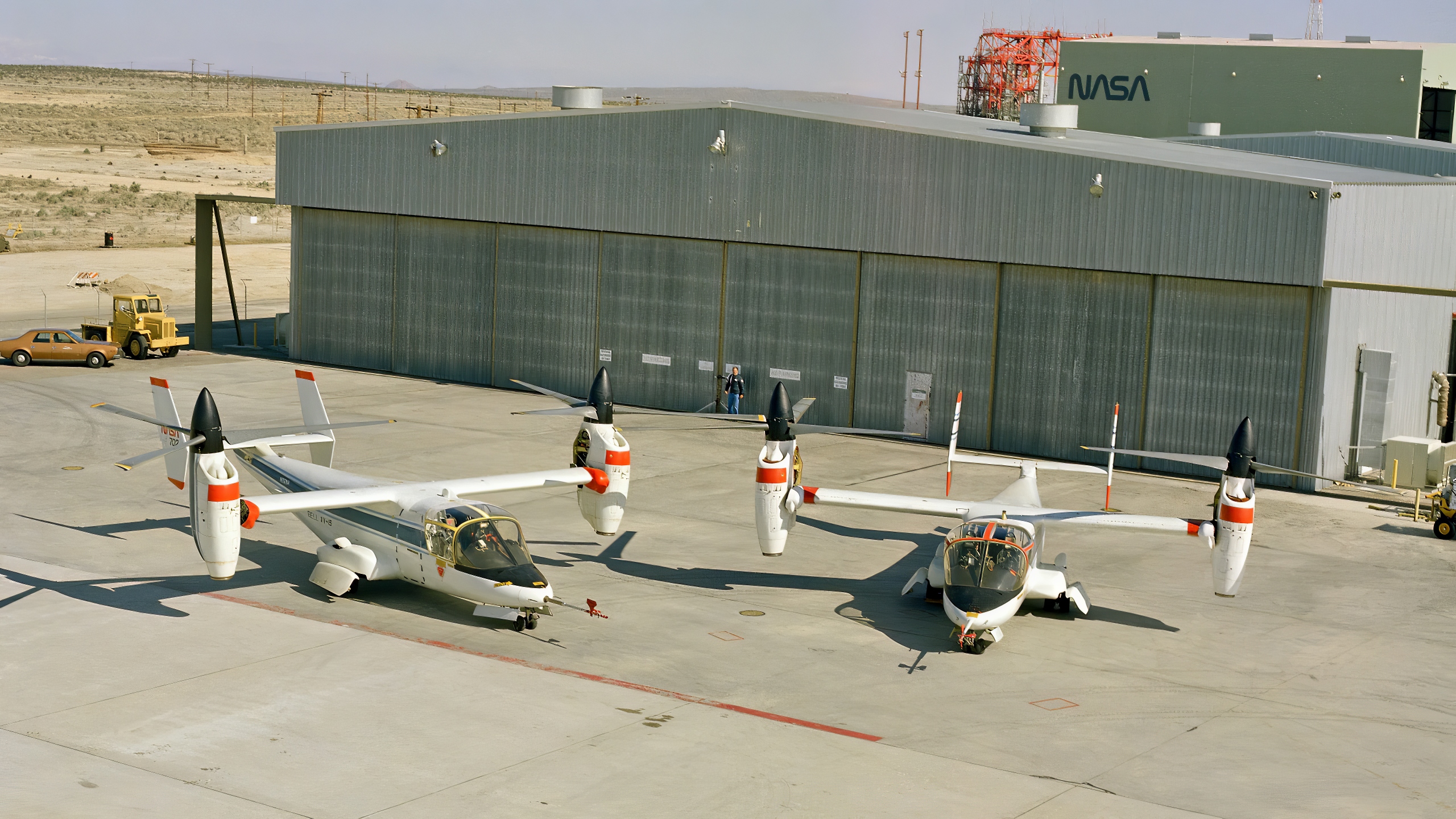 The XV-15 tilt rotor ships #1 and #2 parked on the NASA Dryden Flight Research Center ramp